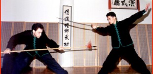 Andrew Neiterman (left) and Danny Silva performing "Single Saber defeats Spear" weapon sparring form during the 17th Anniversary Party.