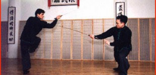 Marlon Pilossoph (left) and Vance Young performing "Sahm Choi Geem", a double-edged sword form that is both a solo weapon set and a weapon sparring set, during the 16th Anniversary Party.